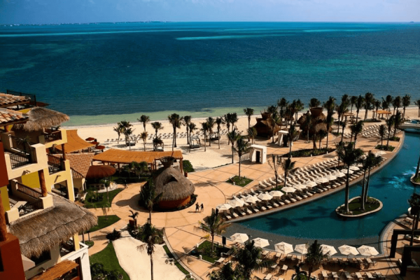 Beachfront resort and turquoise Caribbean water in Cancun, Mexico